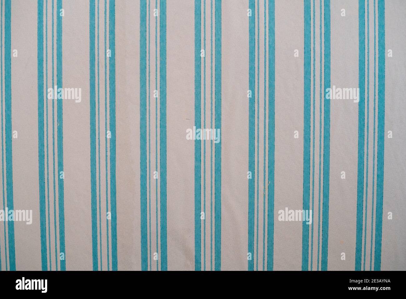 Light bluel striped 19th century wall paper at A section of 19th century abstract wallpaper at the Volkonsky Manor at the Irkutsk Regional Historic Me Stock Photo