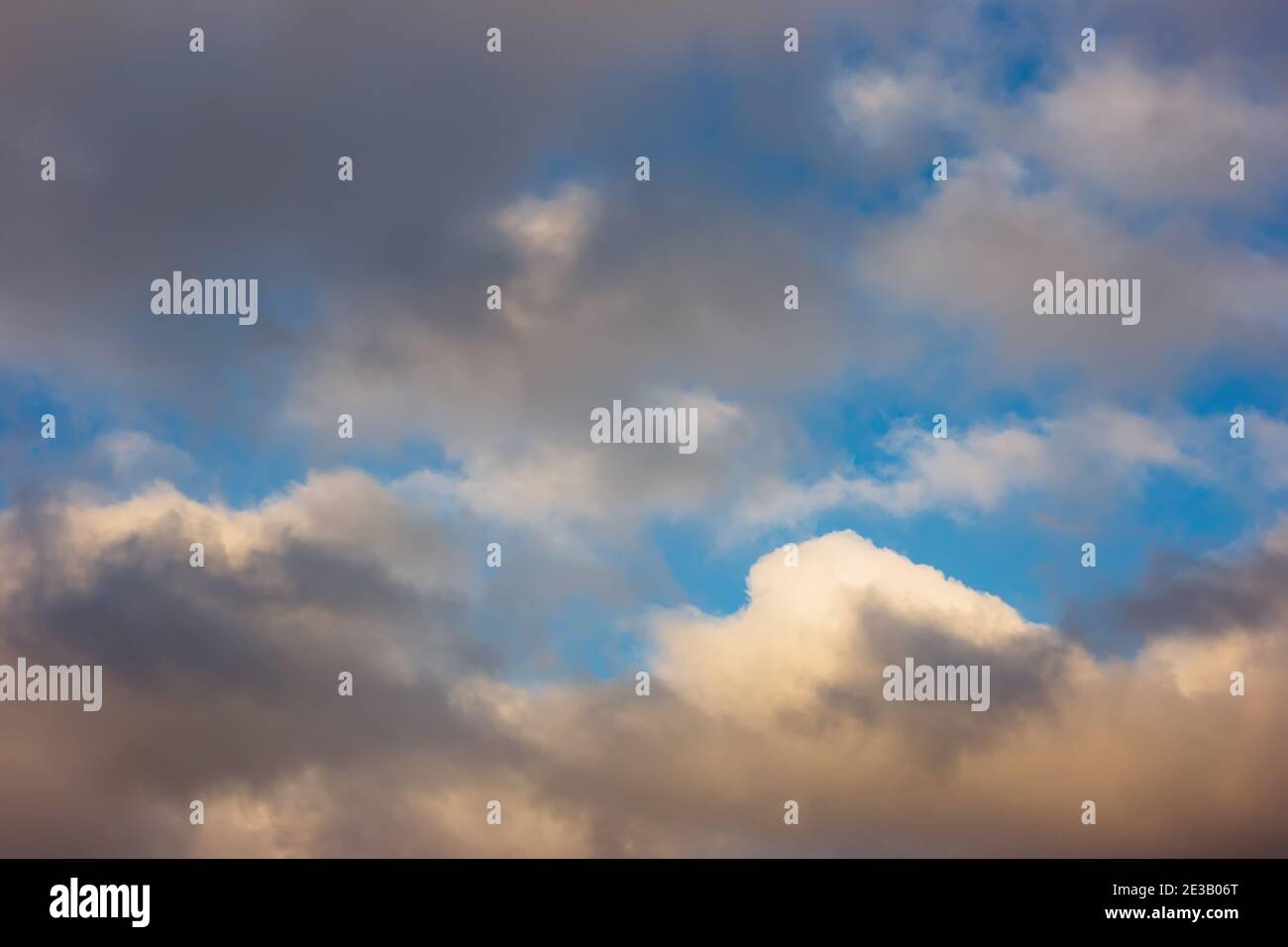 Blue sky with white and gray clouds Stock Photo - Alamy