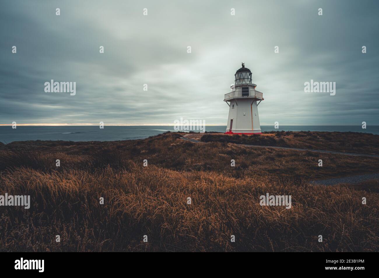 Lighthouse on wild coast at Waipapa Pt, Southland, New Zealand Stock Photo