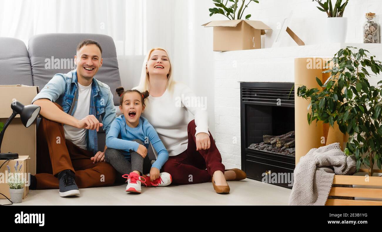 concept housing a young family. Mother father and child in new house ...