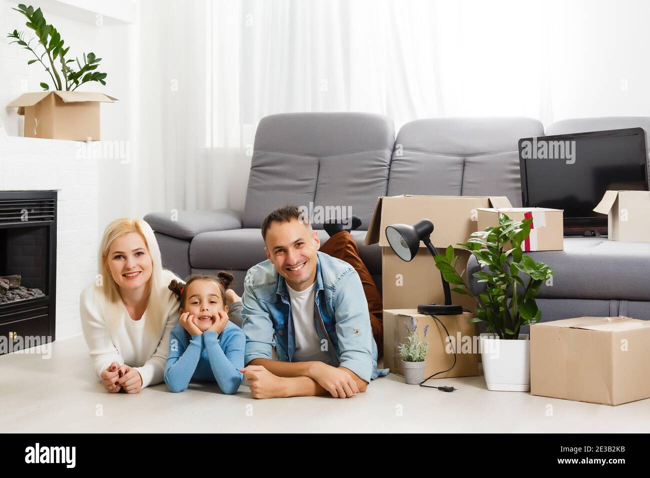 concept housing a young family. Mother father and child in new house ...