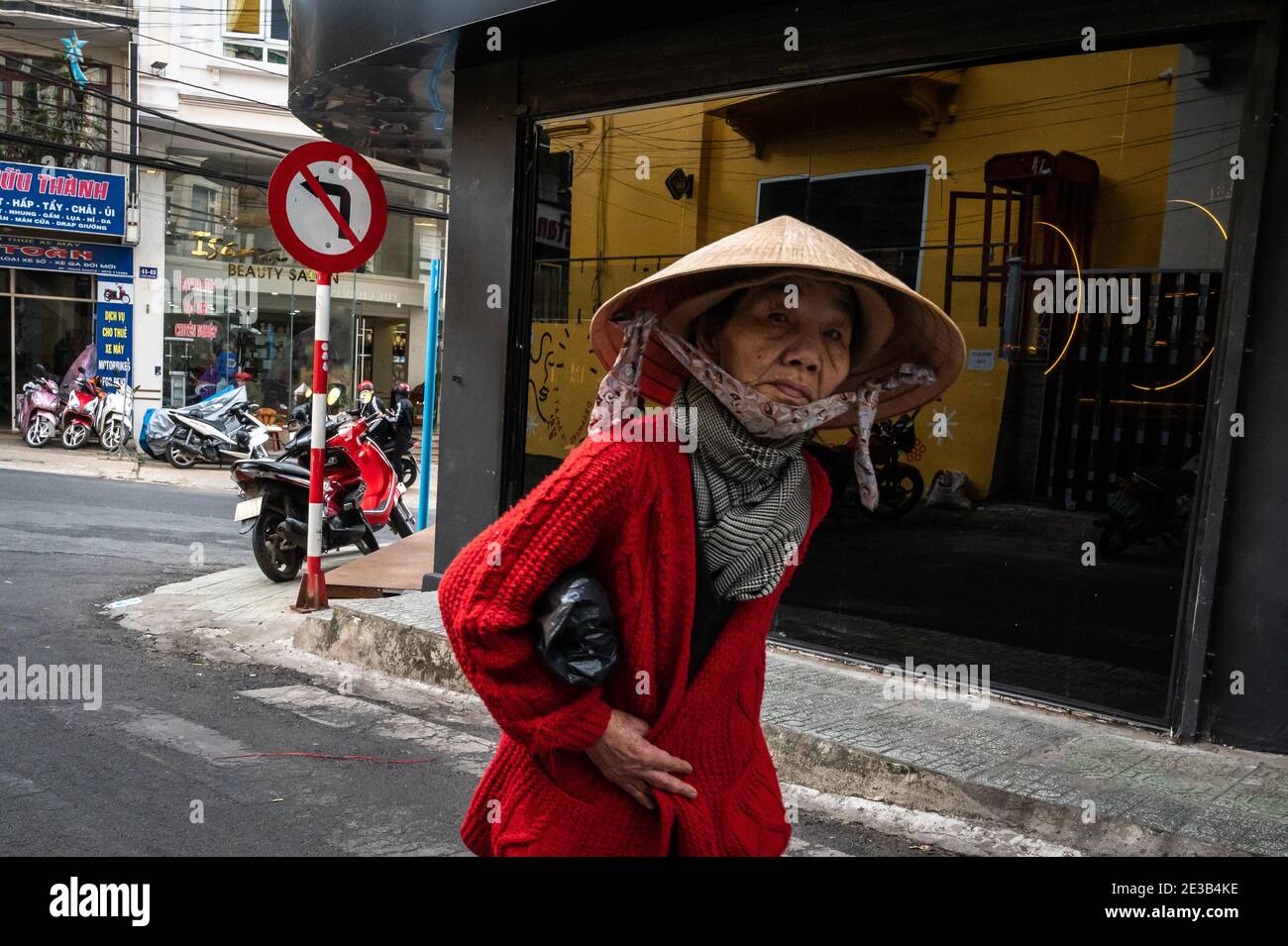 Elderly Vietnamese woman on the street, Dalat, Vietnam Stock Photo