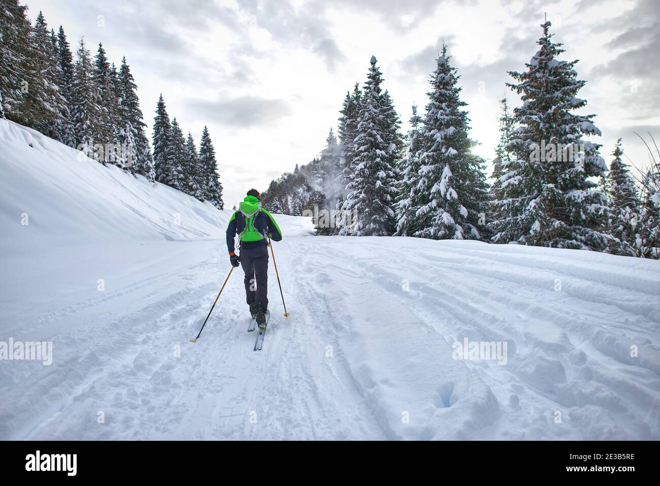 Excursion with mountaineering skis. A man alone in the lane in the