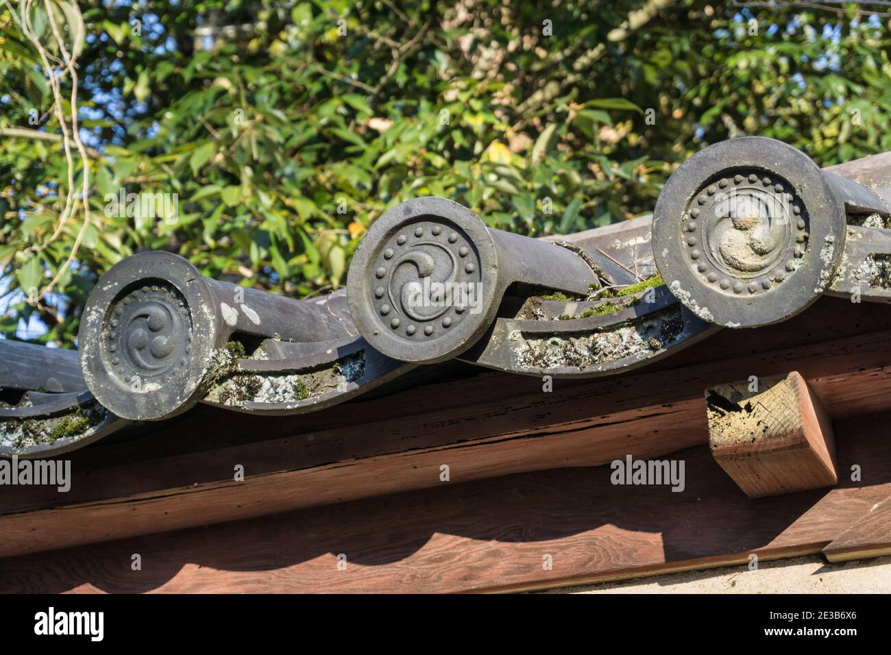 Old, weathered traditional Japanese kawara ceramic roof tiles at