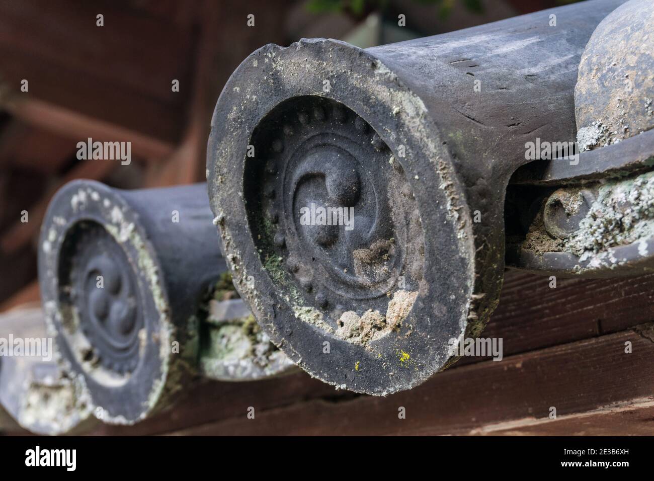 Old, weathered traditional Japanese kawara ceramic roof tiles at