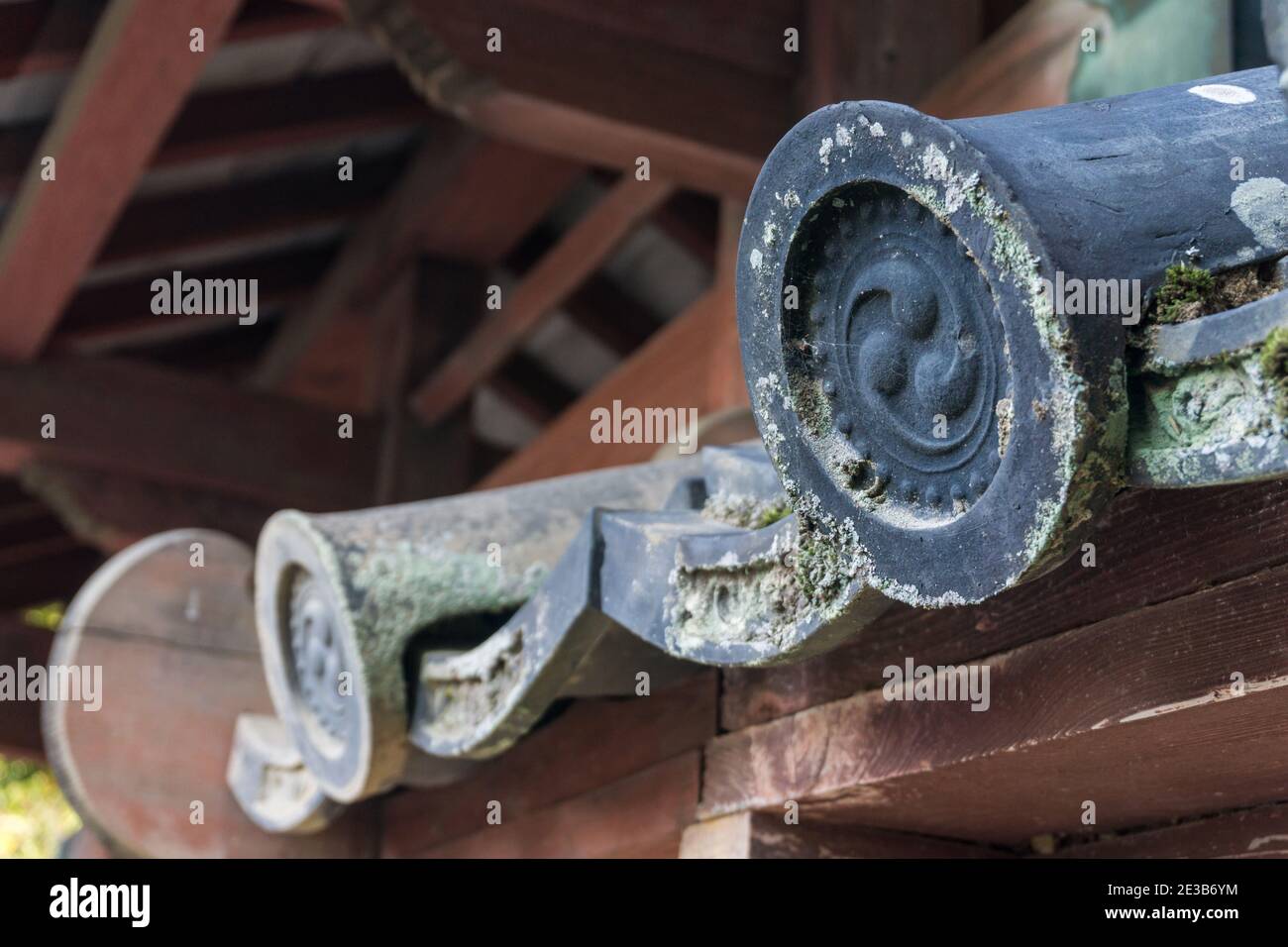 Old, weathered traditional Japanese kawara ceramic roof tiles at