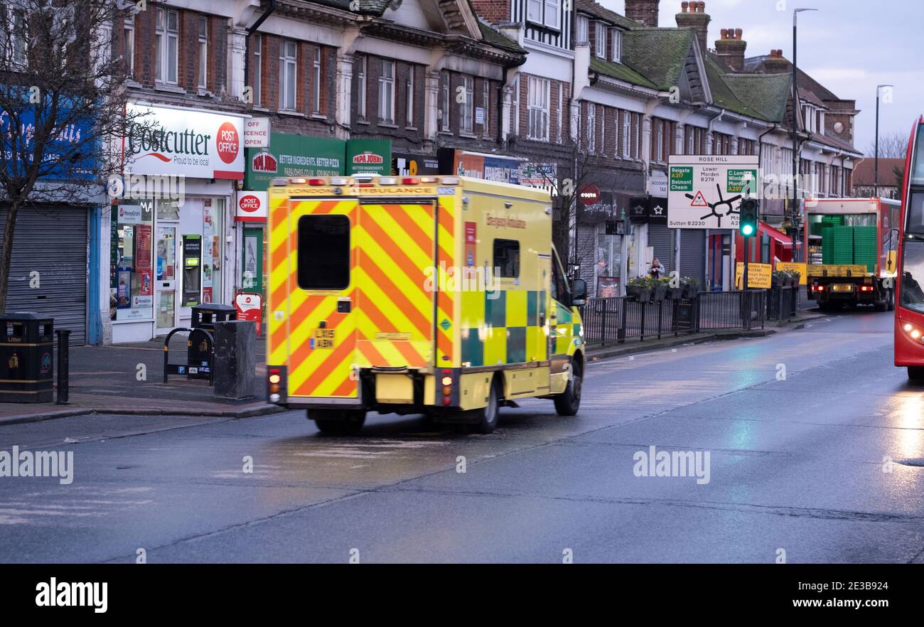 Sutton, Surrey, UK. 18 January 2021. Early morning with an ambulance leaving St Helier Hospital, a major NHS hospital in south London treating Covid patients. The NHS is due to send letters out this week to over 70s offering first Coronavirus vaccinations. Credit: Malcolm Park/Alamy Live News. Stock Photo