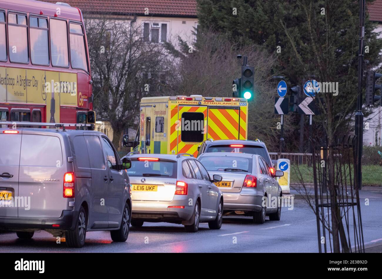 Sutton, Surrey, UK. 18 January 2021. Early morning with an ambulance leaving St Helier Hospital, a major NHS hospital in south London treating Covid patients. The NHS is due to send letters out this week to over 70s offering first Coronavirus vaccinations. Credit: Malcolm Park/Alamy Live News. Stock Photo