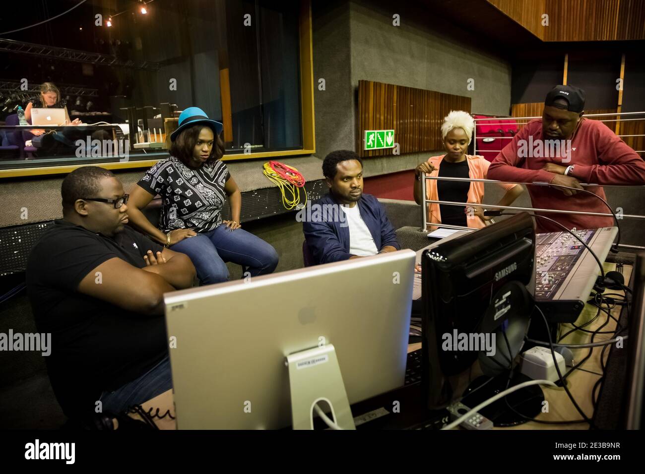 Johannesburg, South Africa - April 28, 2015: Nigerian Music producer Cobhams Asuquo working in studio with African artists Stock Photo