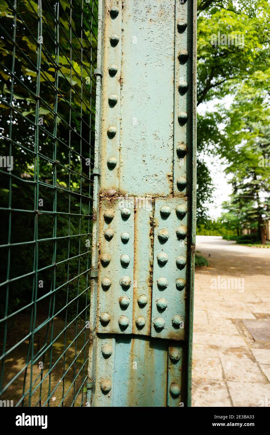 Vertical closeup of the metallic zoo cage for birds in Poznan, Poland Stock Photo