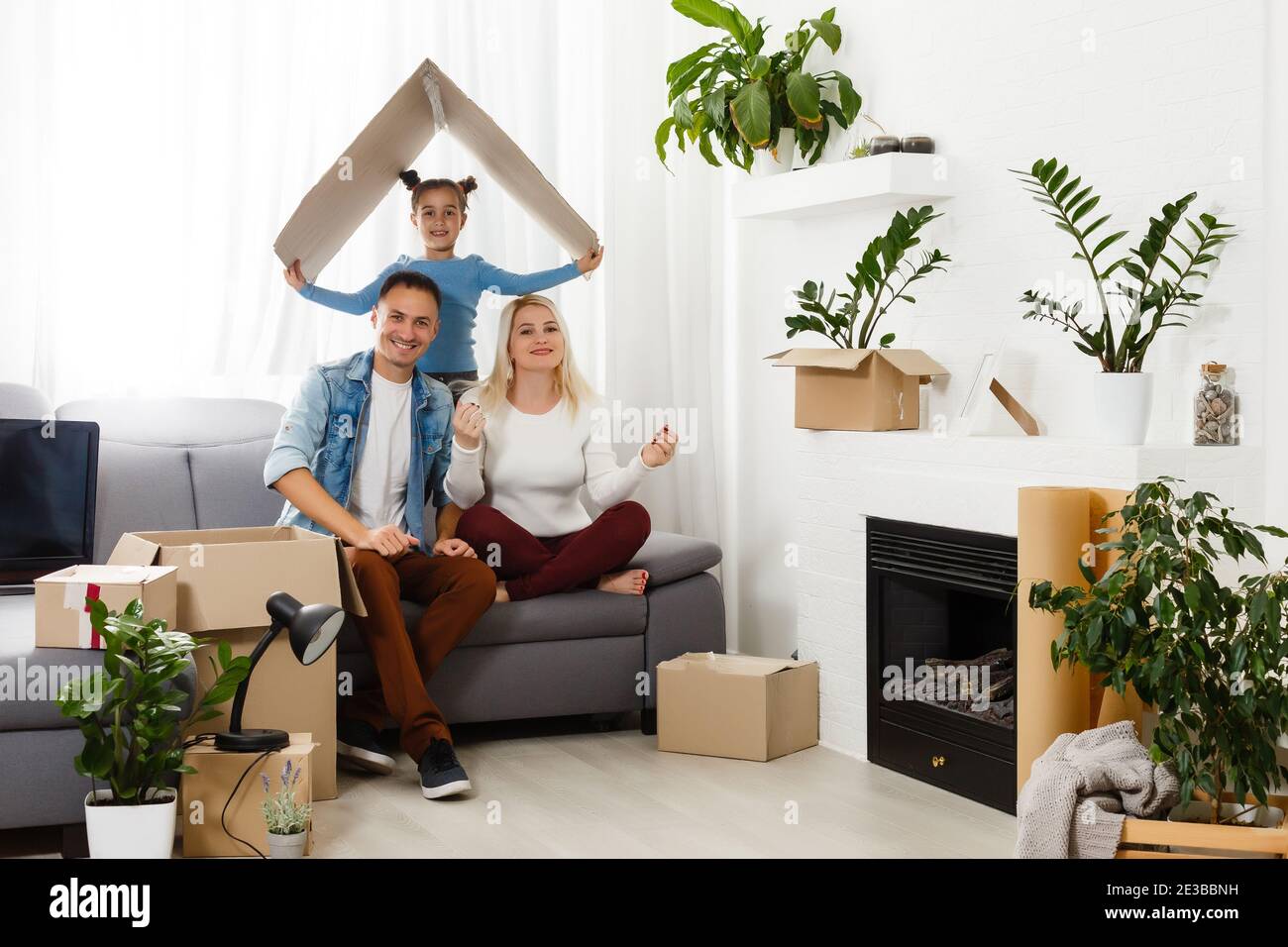 concept housing a young family. Mother father and child in new house ...