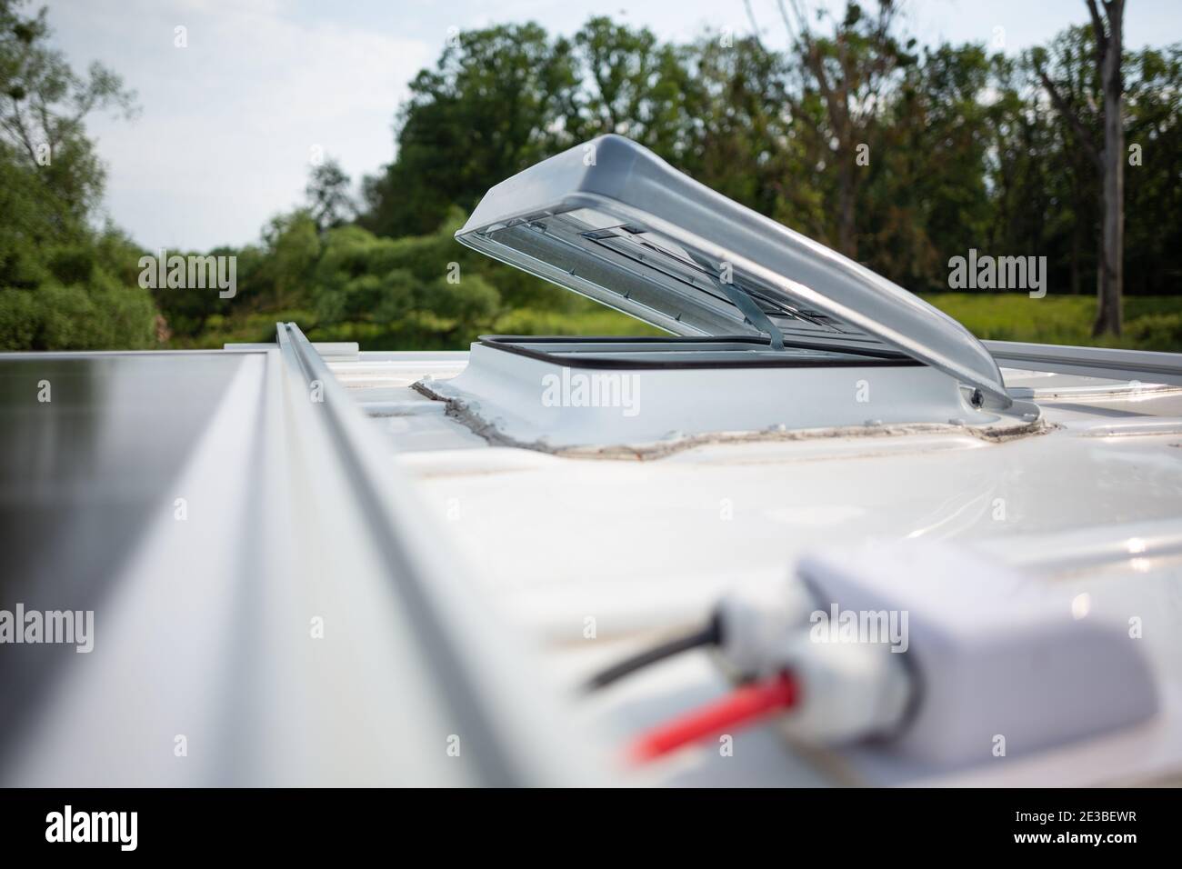 Open roof hatch on a camper van Stock Photo