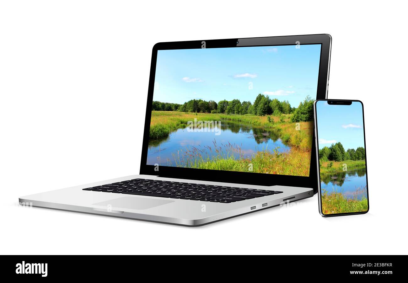 Laptop and phone with landscape wallpaper on screen Stock Photo