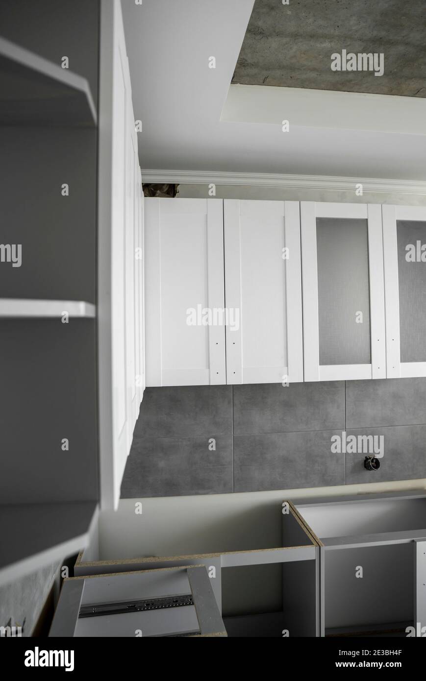 Custom kitchen installation with a furniture facades mdf. Gray