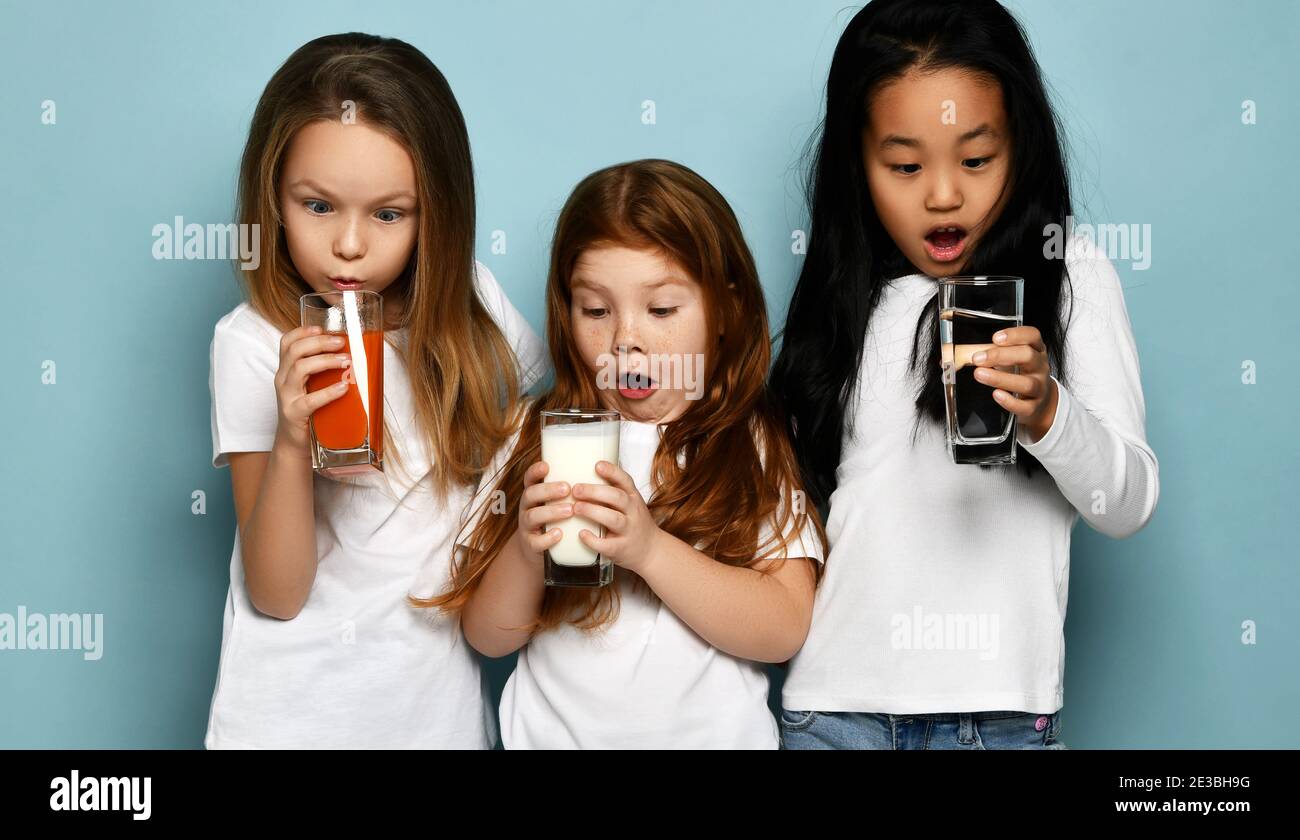 International group of kids children drink different beverages milk
