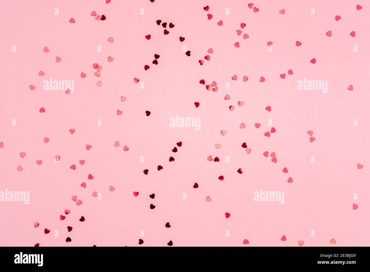 Pink background with glitter hearts for valentine's day Stock Photo - Alamy