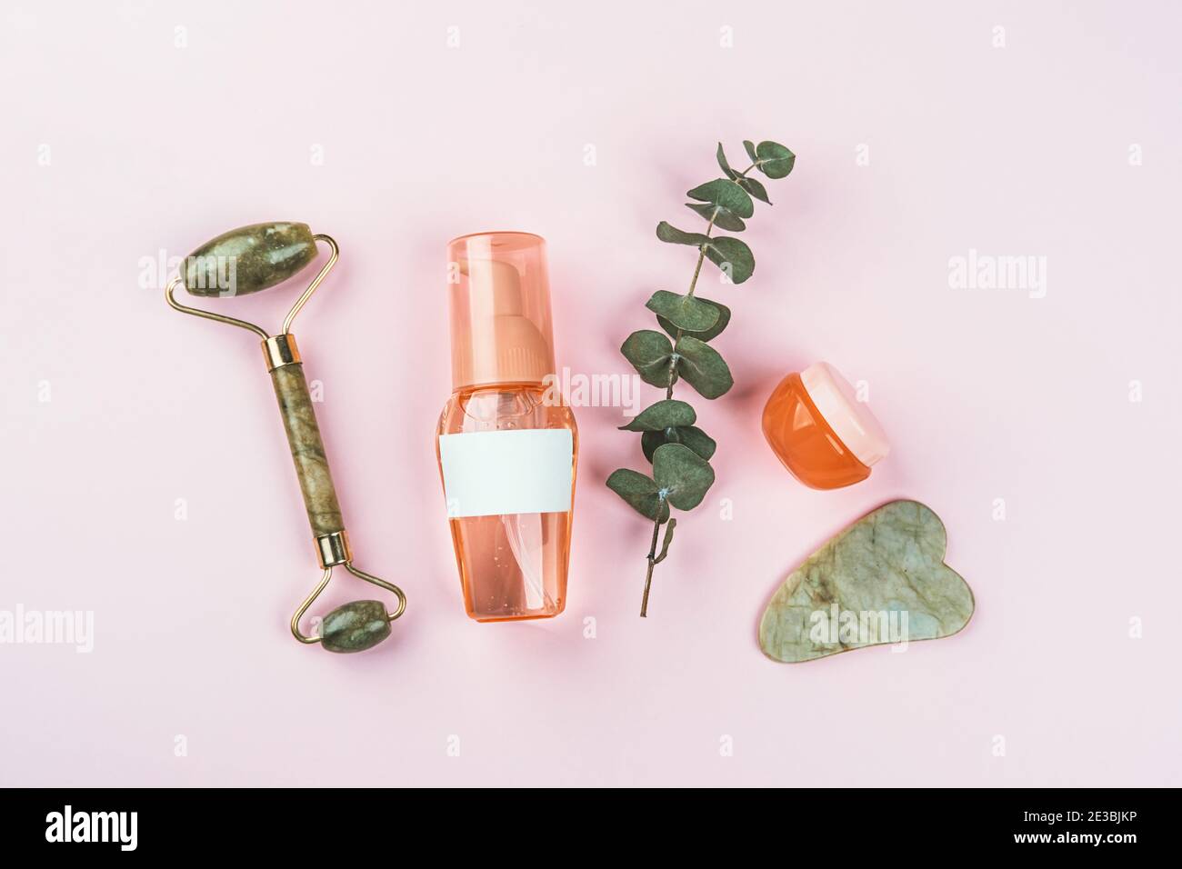 Plastic bottles and jars on pink background Stock Photo