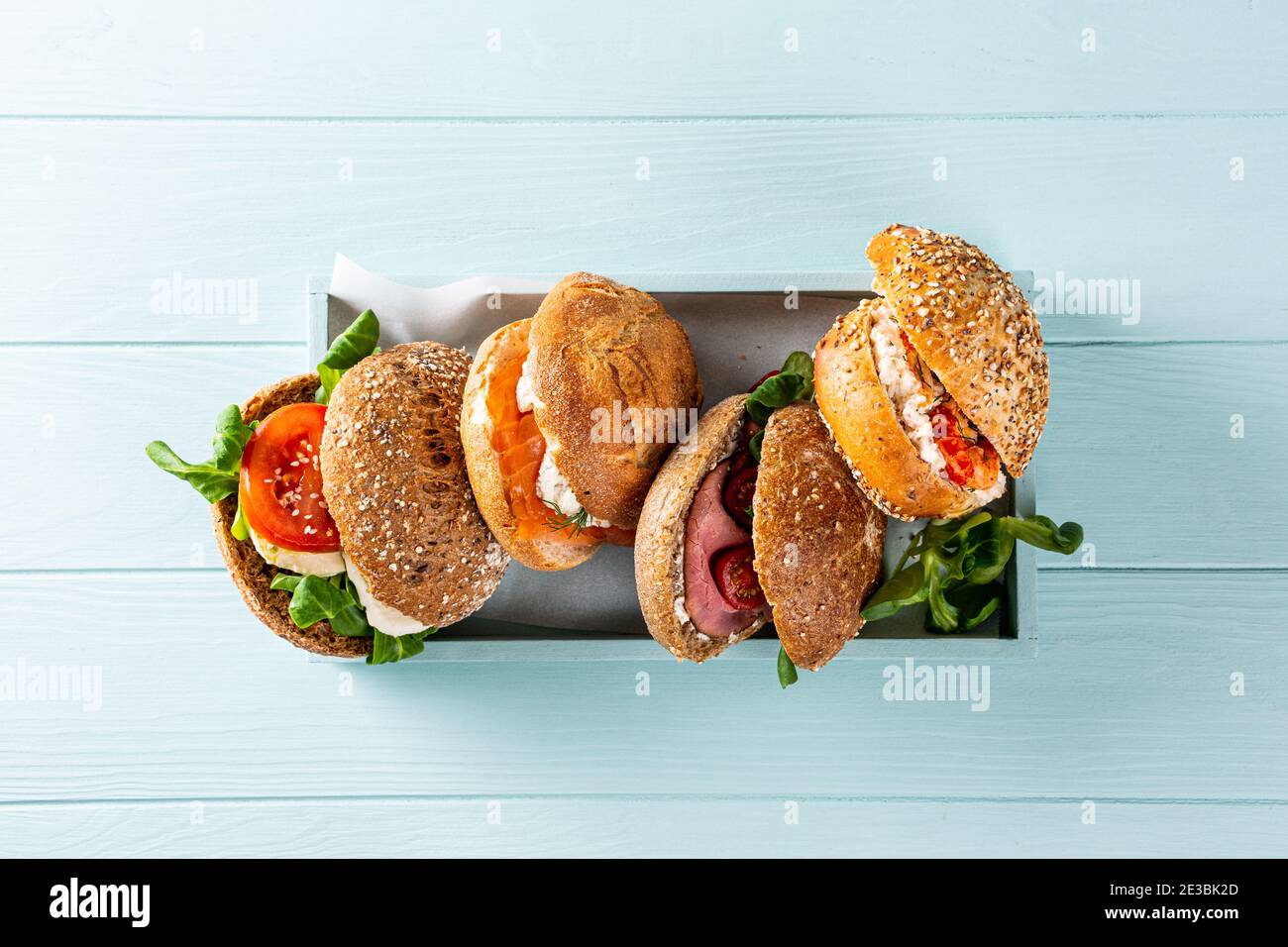 Assorted sandwiches in wooden box Stock Photo