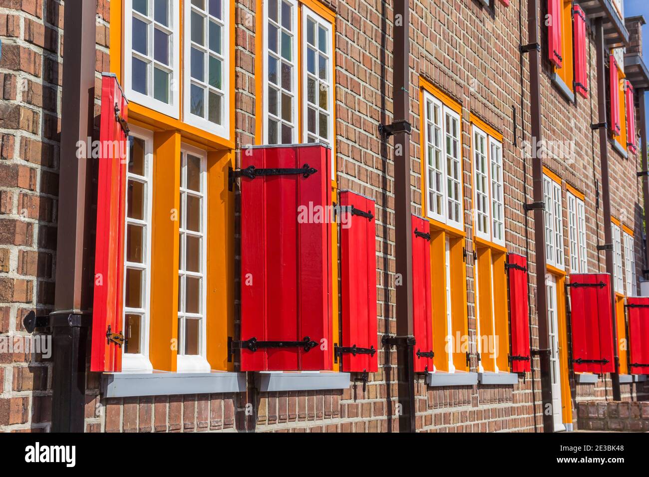 Red and orange windows on a restaurant in Tubbergen, Netherlands Stock Photo