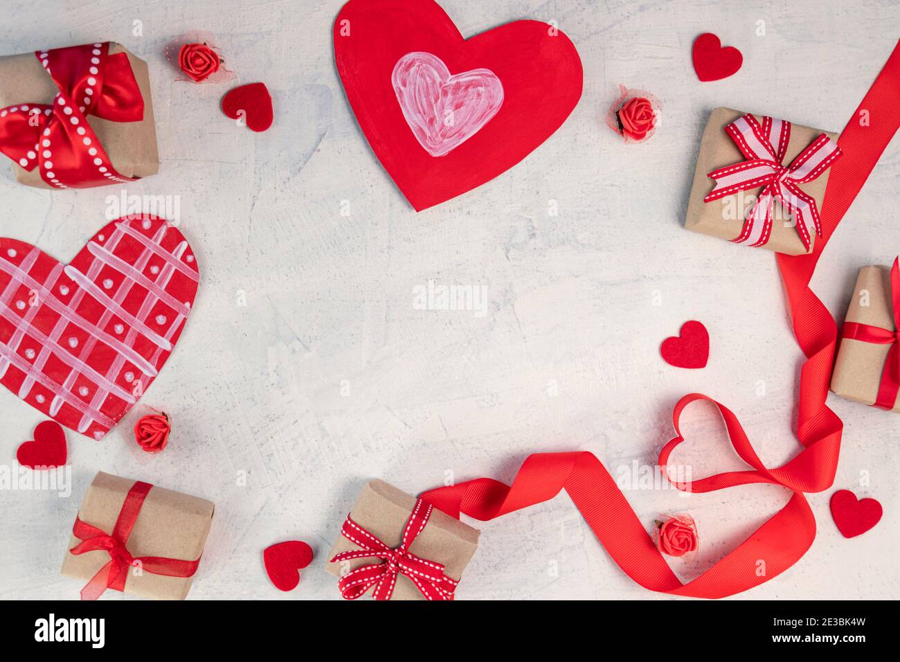 Heart from a red ribbon, gifts with a red ribbon and red hearts on a ...