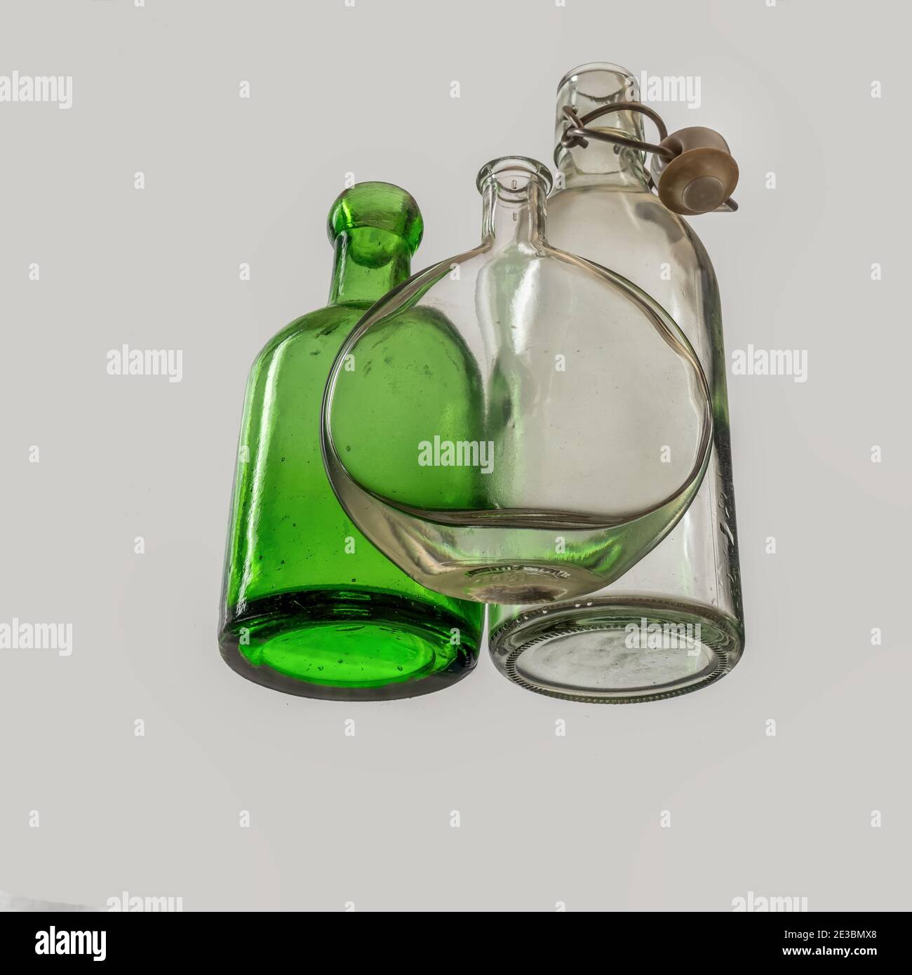 Empty old glass bottles, seen from beneath. Stock Photo