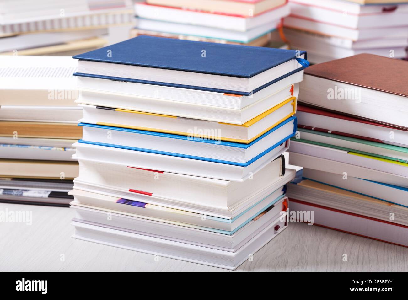 stack of various books in a library Stock Photo - Alamy