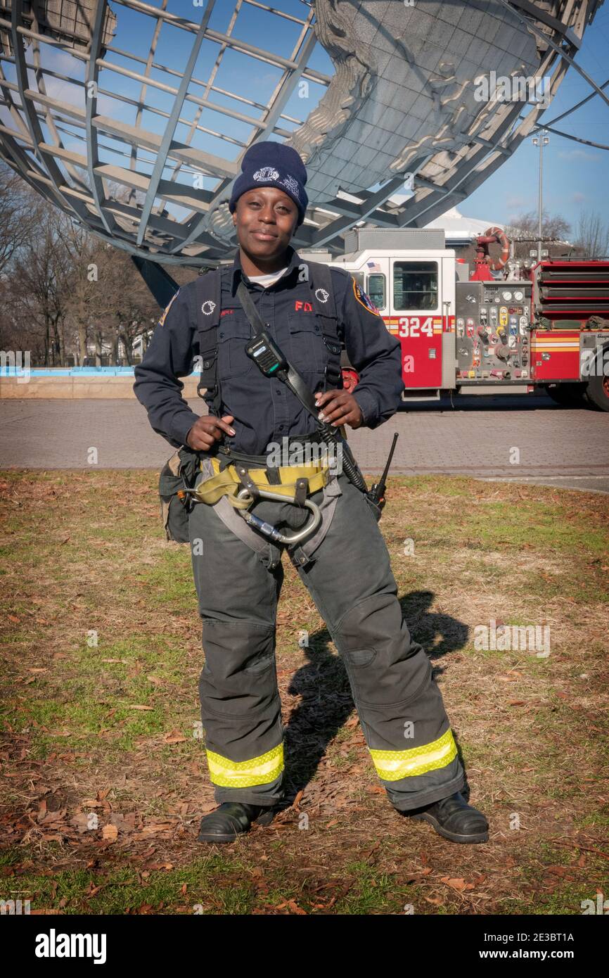 An attractive woman firefighter in uniform at Flushing Meadows Corona Park  in Queens, New York Stock Photo - Alamy