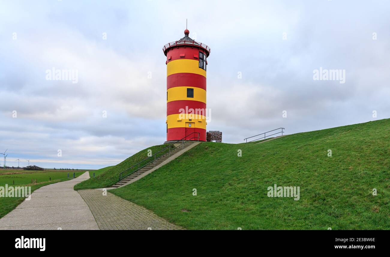 Famous lighthouse of Pilsum in Easter Frisia aka Ostfriesland at the North Sea coast Stock Photo