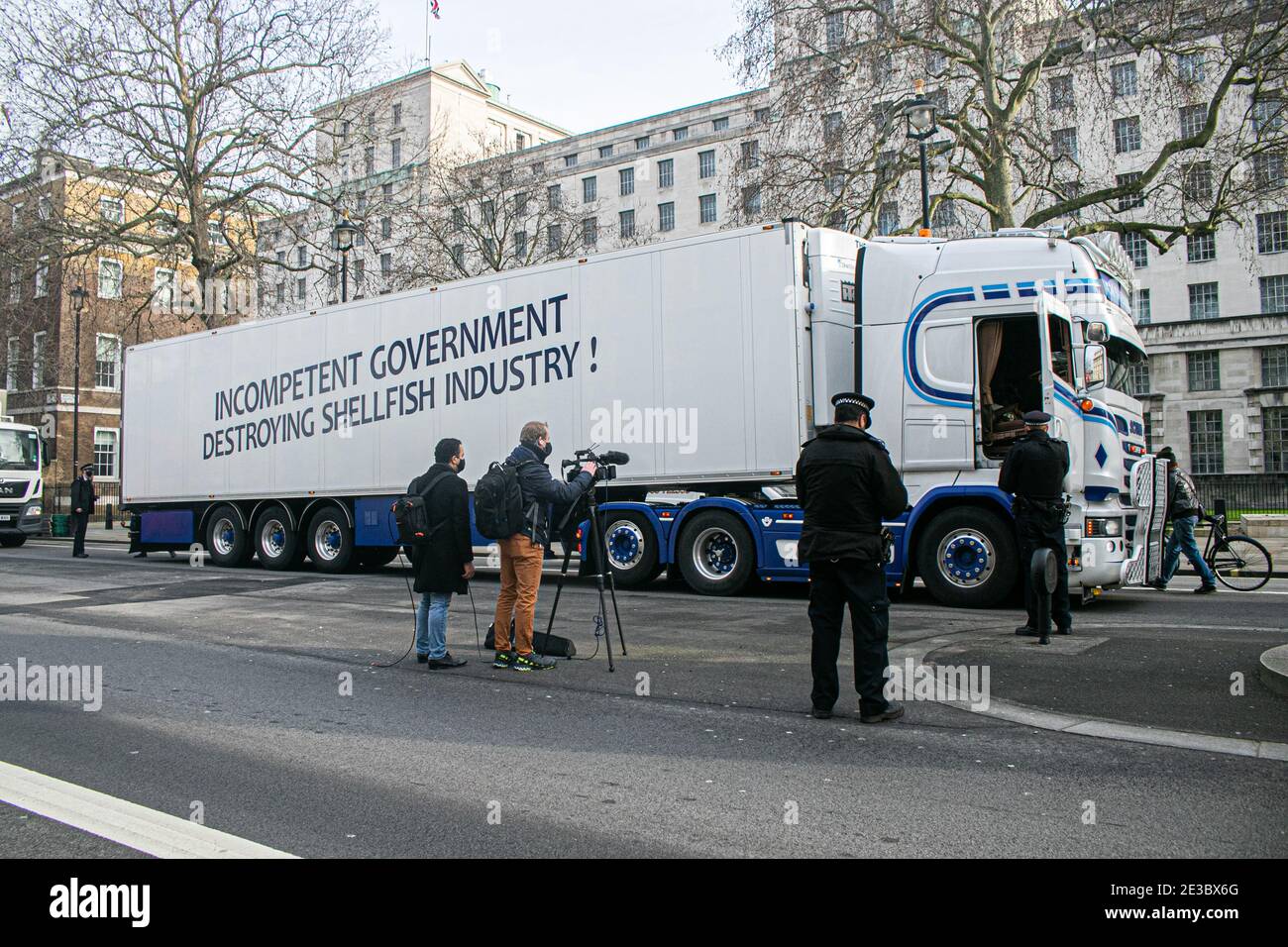 WESTMINSTER  LONDON, UK  18 January 2021.  A number of lorries from Scottish seafood suppliers, have parked up opposite  Downing Street and Whitehall in a protest  faced by the UK fishing industry  to raise awareness at the  paperwork following Brexit at the border with the European Union  issues that have left many seafood exporters struggling to survive. Credit: amer ghazzal/Alamy Live News Stock Photo