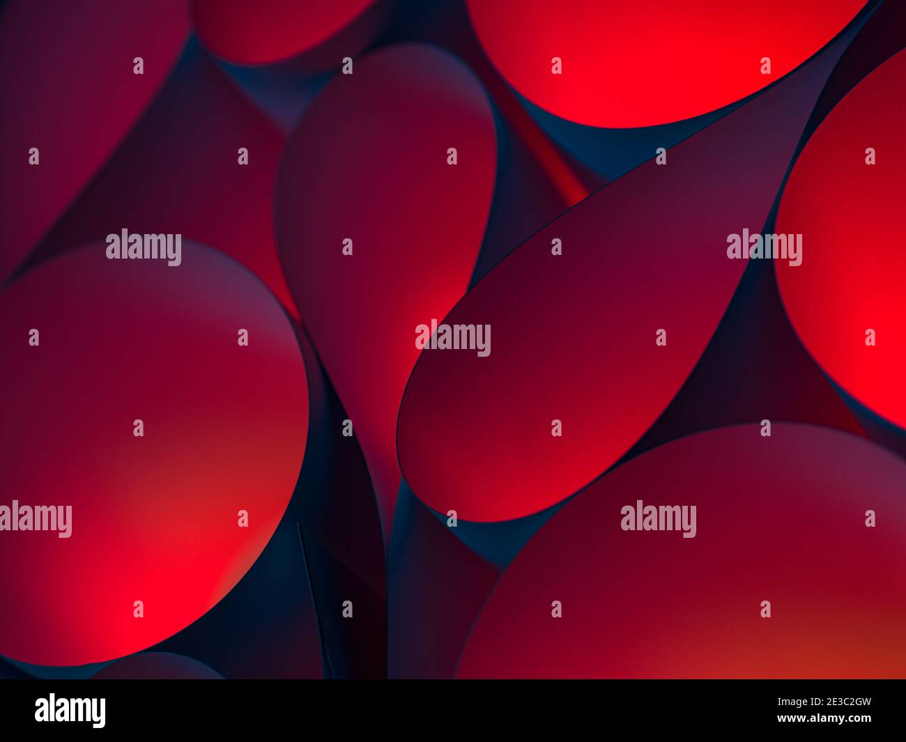 Abstract close up photo of curve shapes made of white paper illuminated with red and blue filter