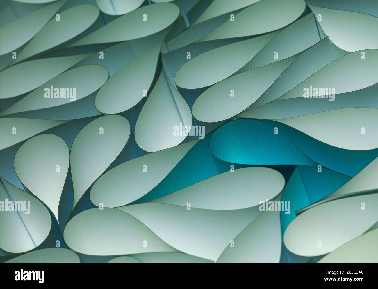 Background macro image of origami pattern made of curved sheets of paper. Stock Photo
