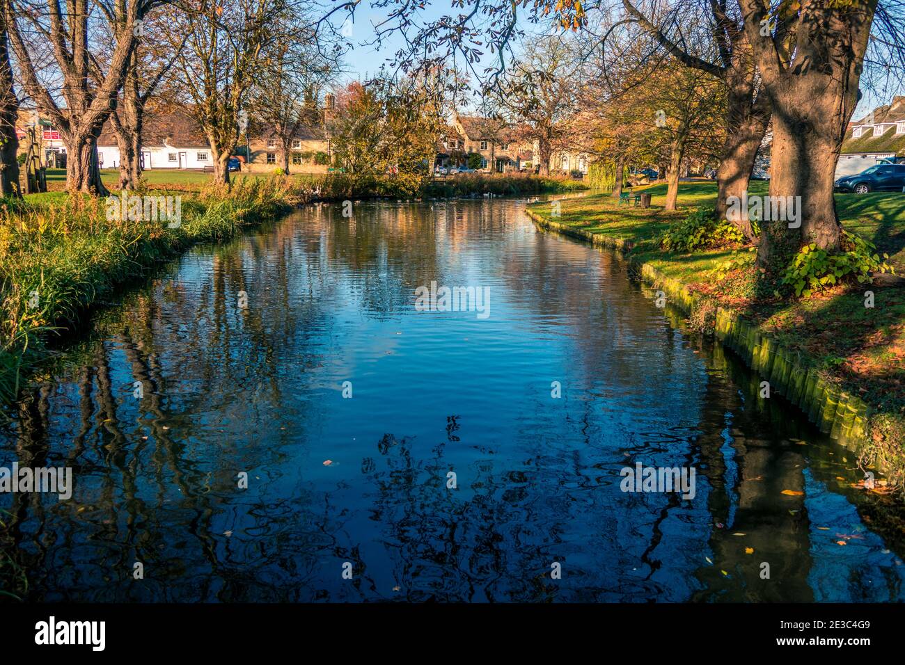 Autumn view of the Green and village pond at Histon near Cambridge England Stock Photo