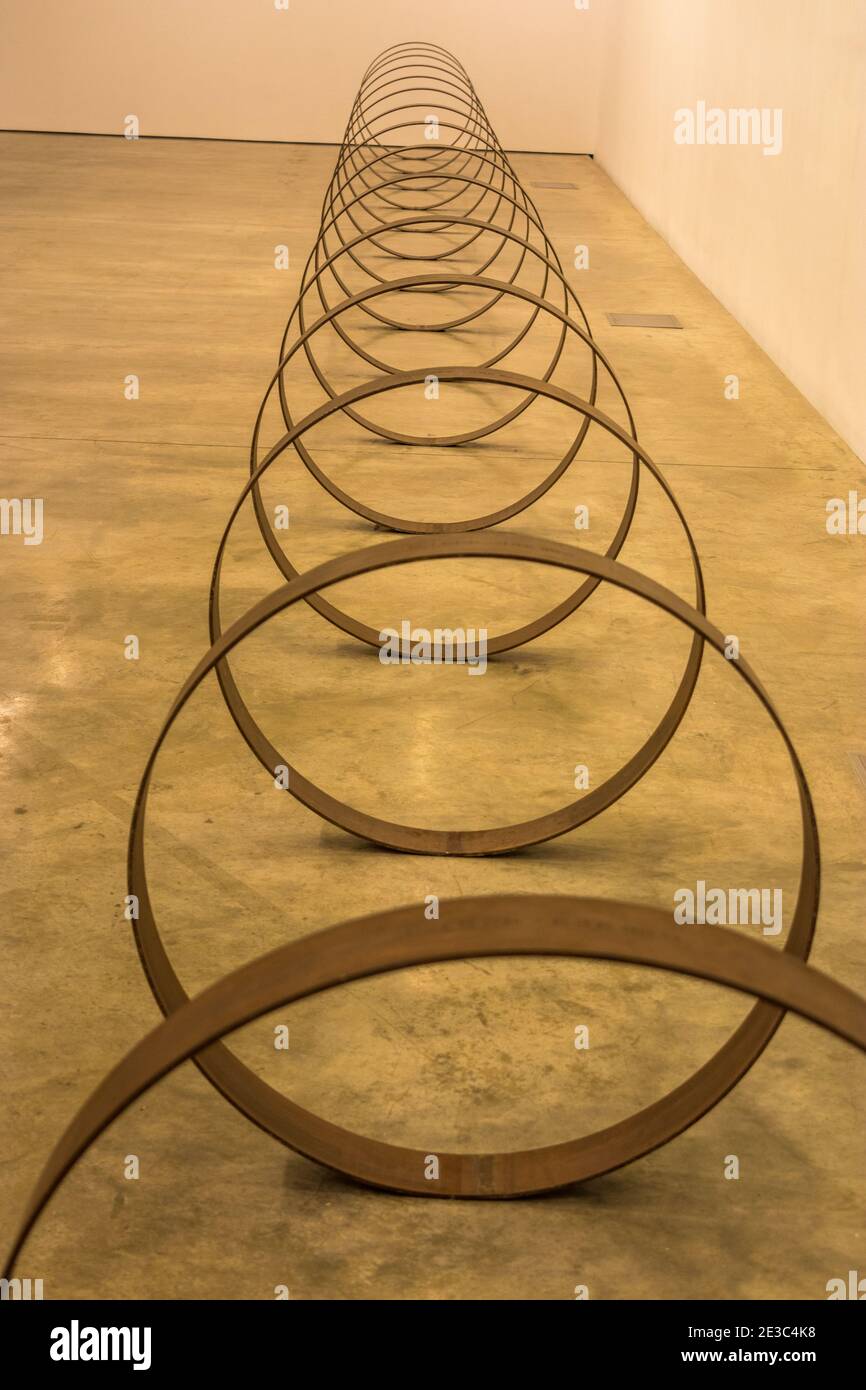 28 rolled steel rings, each one engraved with a distance in kilometres, a longitude, latitude and the elevation of a specific point along the TAPline Stock Photo