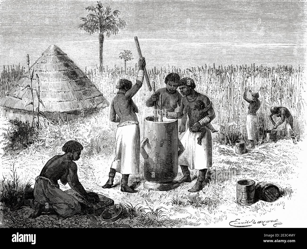 Women crushing sorghum in Unyamwezi village, Tanzania, Africa. Old XIX century engraved from Le Tour du Monde 1864 Stock Photo