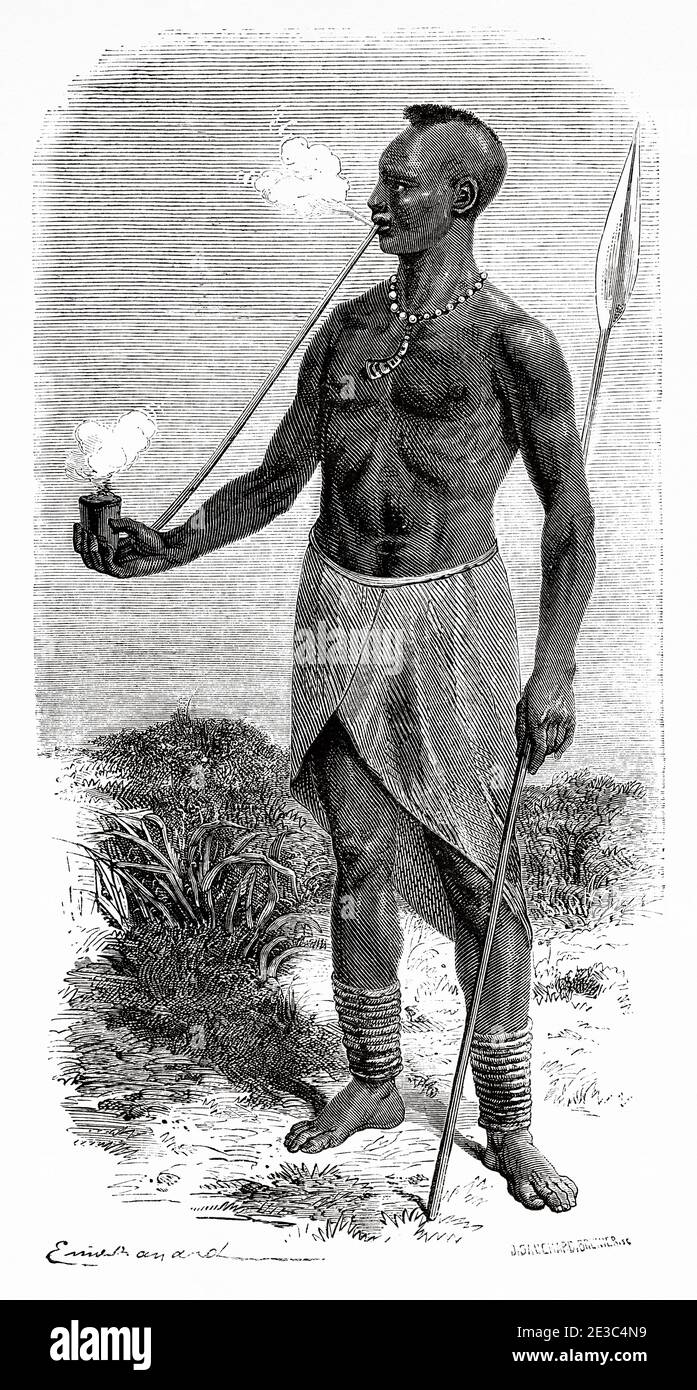 Karague man smoking tobacco in a pipe, Uganda, Africa. Old XIX century engraved from Le Tour du Monde 1864 Stock Photo