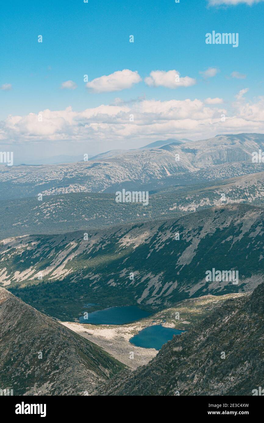 Panoramic view of mountain ranges. Rock ridge with various peaks for ...
