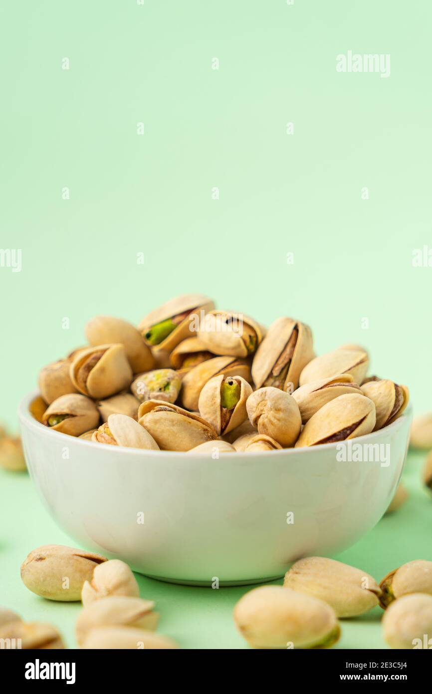 toasted pistachios in a bowl. Nuts vegan protein Stock Photo Alamy