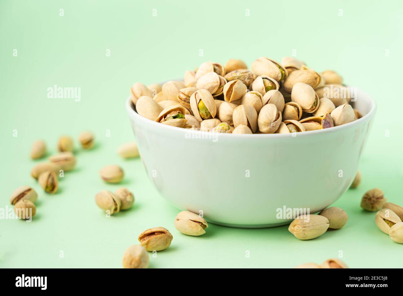 toasted pistachios in a bowl. Nuts vegan protein Stock Photo