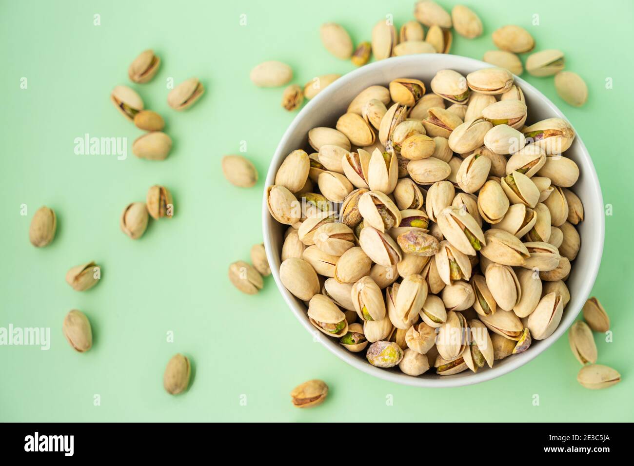toasted pistachios in a bowl. Nuts vegan protein Stock Photo