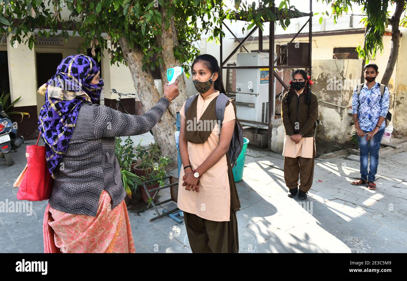 Beawar, Rajasthan, India, Jan. 18,2021: Students undergo thermal screening as they arrive to attend classes at a government school that was reopened after remaining closed for 309 days due to COVID-19 pandemic in Beawar. Credit: Sumit Saraswat/Alamy Live News Stock Photo