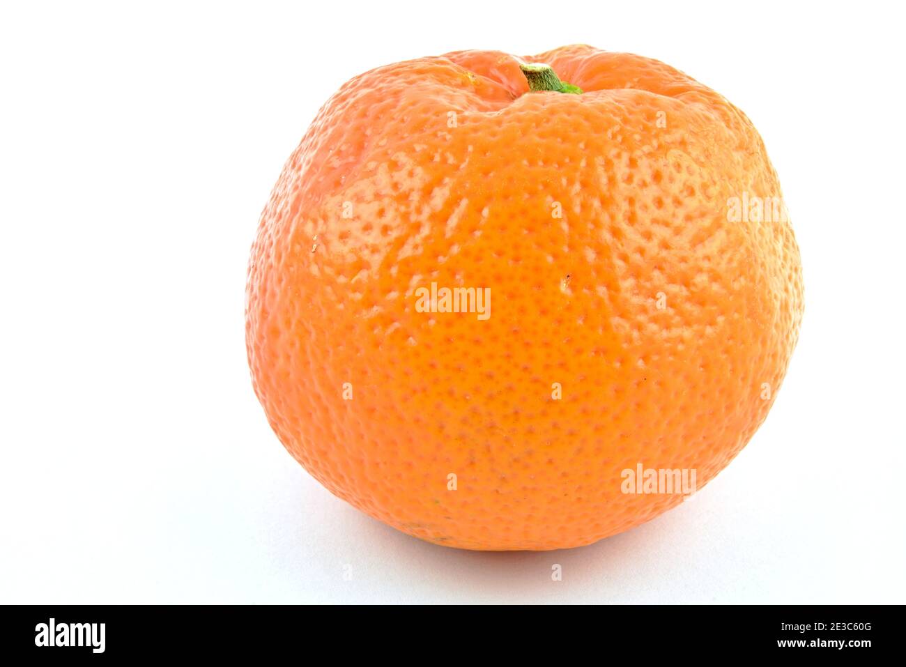 Orange Mandarin (Clementine). Fruit. Tangerine whole with a small stem. Separated on white background. Stock Photo