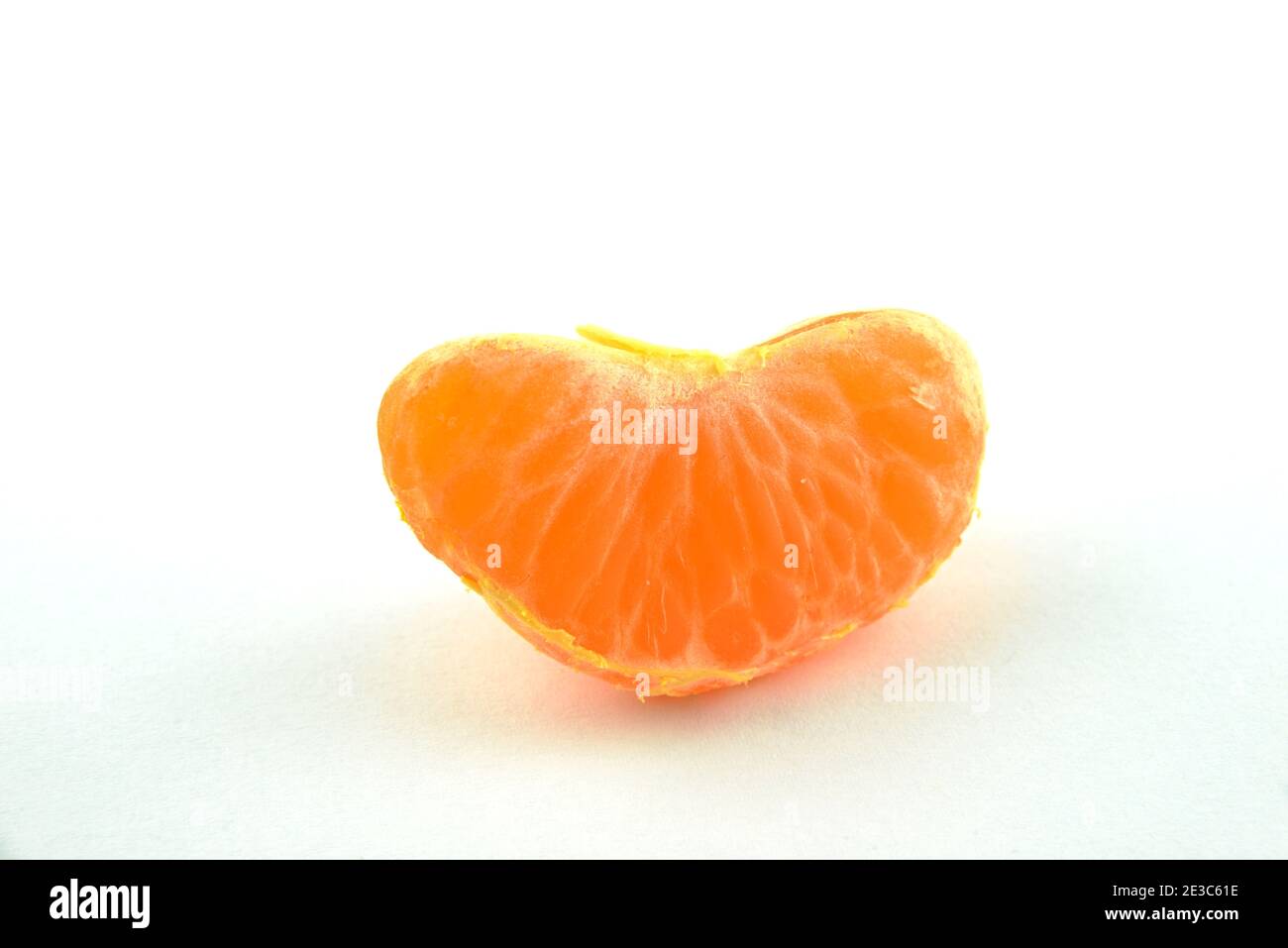 Peeled orange Mandarin (Clementine). Separated on white background. Stock Photo
