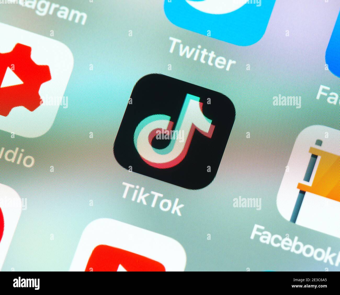 TikTok app icon on Apple iPhone screen. TikTok is a video sharing social networking service owned by Chinese company ByteDance. Stock Photo