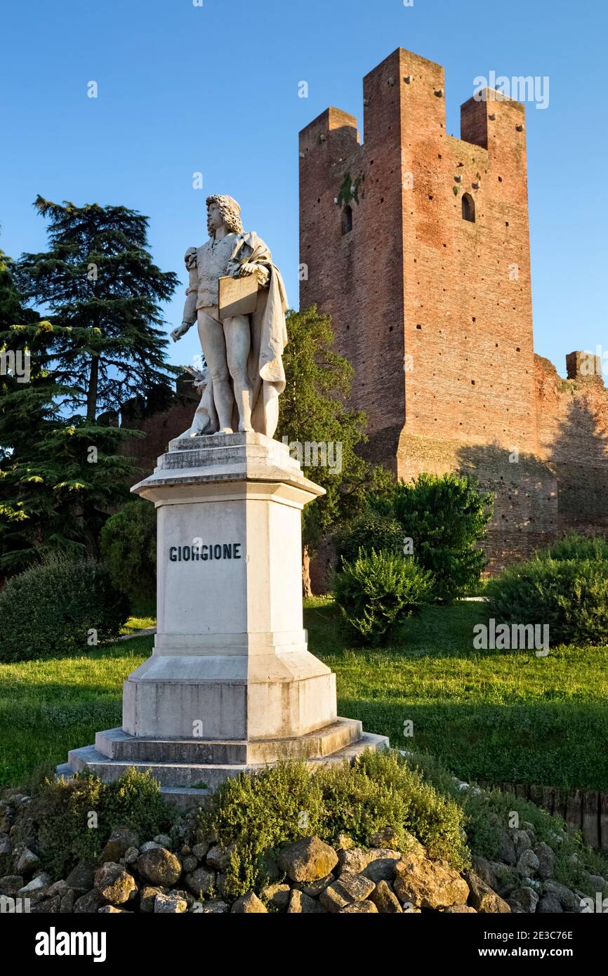The statue of the painter Giorgione at the medieval walls of Castelfranco Veneto. Treviso province, Veneto, Italy, Europe. Stock Photo