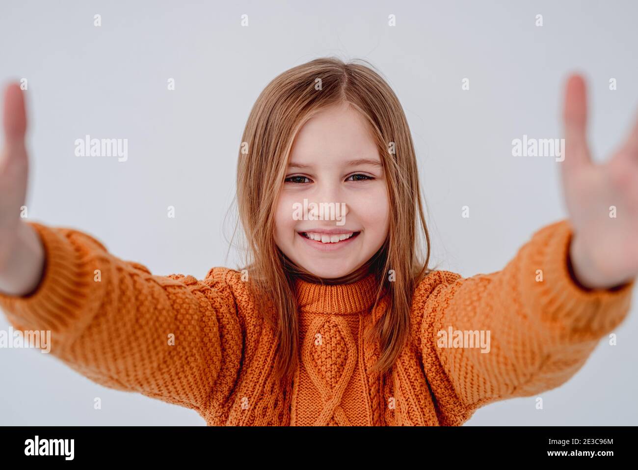 Portrait of little girl on white background Stock Photo - Alamy