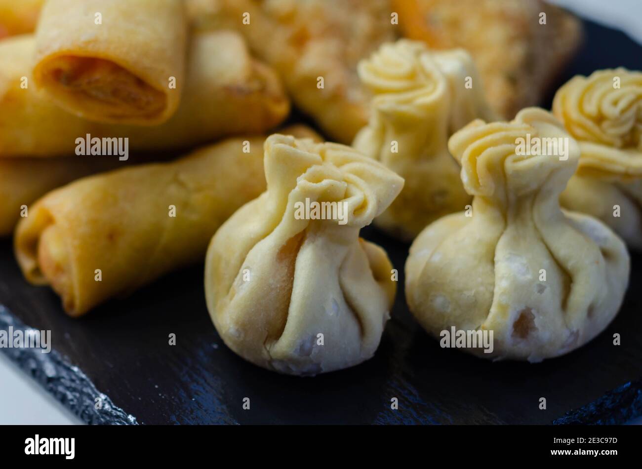 Sweet and sour vegetable wontons, Traditional chinese dumplings filled with bean sprouts, red