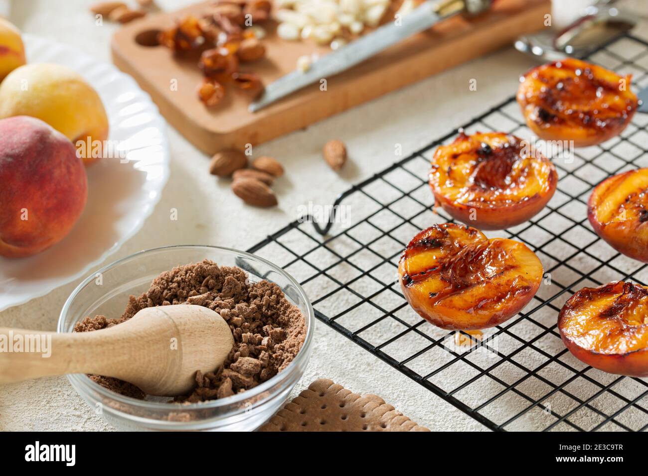 Grilled peaches summer dessert American bbq. Served with almonds, ice