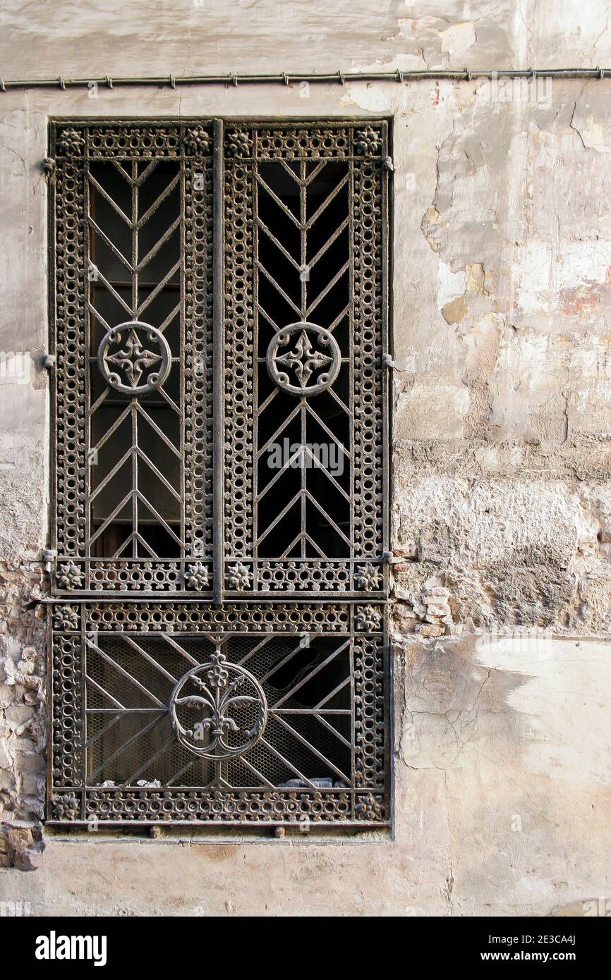Close up of decorative antique wrought iron window grille on a townhouse in the historice town of Xativa in the Valencian region of Spain Stock Photo