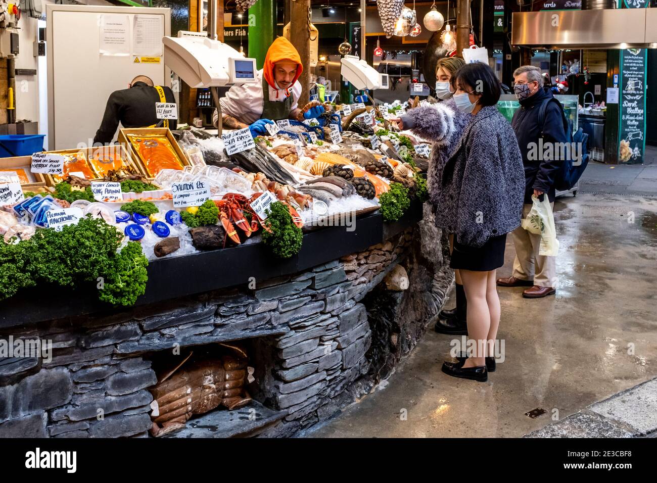Young Asian Women Buying Seafood At Borough Market, London, UK. Stock Photo