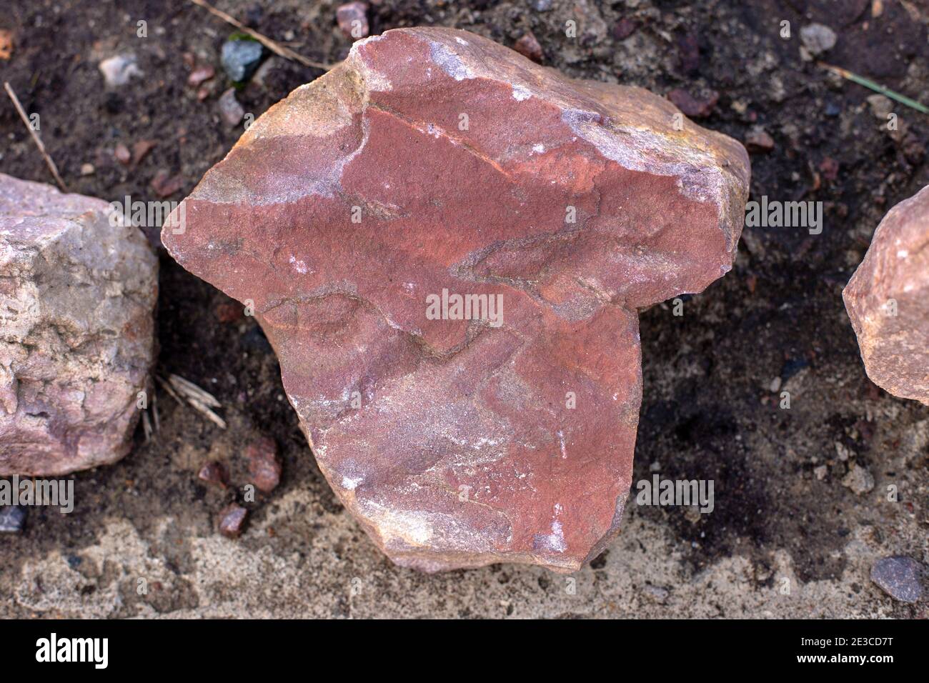 Pink sandstone stone on the dark ground Stock Photo - Alamy